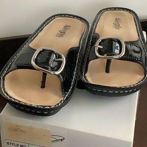 Algeria flip flops.  Black patent leather.  Size 7.